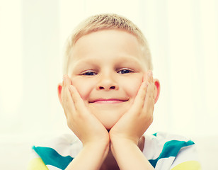 Image showing smiling little student boy at home