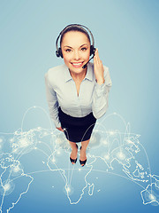 Image showing friendly female helpline operator with headphones