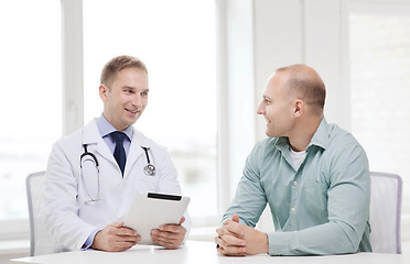 Image showing doctor with tablet pc and patient in hospital