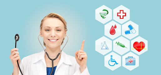 Image showing smiling doctor over medical icons blue background