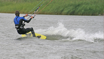 Image showing A Windkiter making a steep turn.