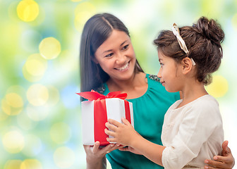 Image showing happy mother and daughter with gift box