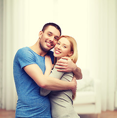 Image showing smiling couple hugging