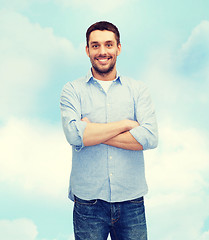 Image showing smiling man with crossed arms