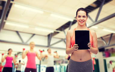 Image showing sporty woman with tablet pc blank screen