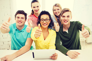 Image showing smiling students with tablet pc computer at school