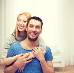 Image showing smiling couple hugging