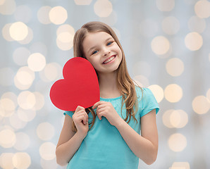 Image showing smiling little girl with red heart