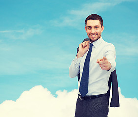 Image showing handsome businessman with jacket over shoulder