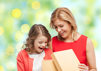 Image showing happy mother and daughter opening gift box