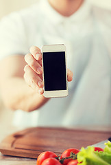 Image showing close up of male hands holding smartphone