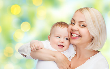 Image showing happy mother with baby over green background