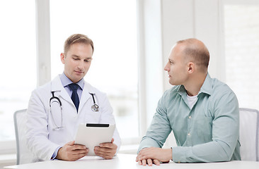 Image showing doctor with tablet pc and patient in hospital