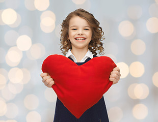 Image showing smiling little girl with red heart