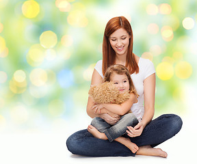 Image showing happy mother with adorable girl and teddy bear