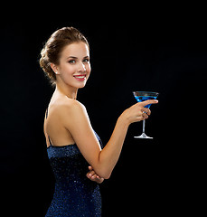 Image showing smiling woman holding cocktail