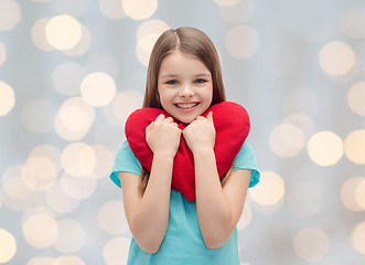 Image showing smiling little girl with red heart