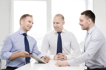 Image showing business team working with tablet pc in office