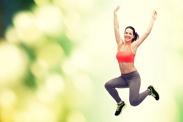 Image showing sporty teenage girl jumping in sportswear