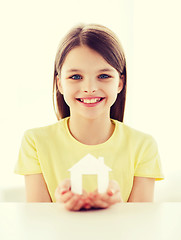 Image showing little girl holding white paper house