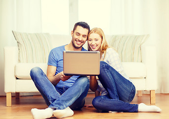 Image showing smiling happy couple with laptop at home