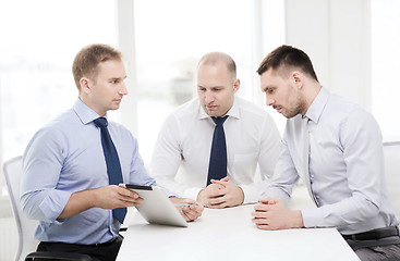 Image showing business team working with tablet pc in office