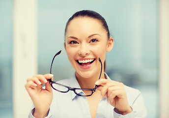 Image showing laughing businesswoman with glasses