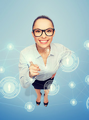 Image showing smiling businesswoman with finger up