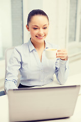 Image showing smiling businesswoman or student with laptop