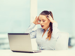 Image showing stressed woman with laptop