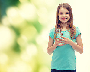 Image showing smiling little girl with glass of water