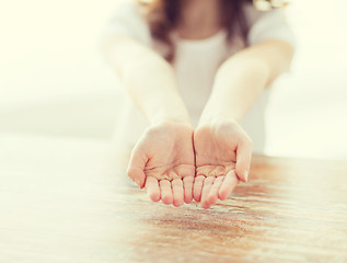 Image showing close up of little girl showing empty cupped hands