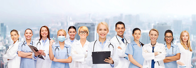 Image showing smiling female doctors and nurses with stethoscope