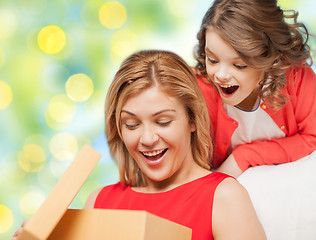 Image showing happy mother and daughter opening gift box