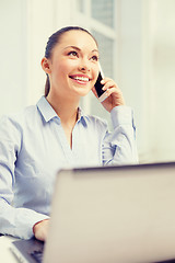 Image showing smiling businesswoman with laptop