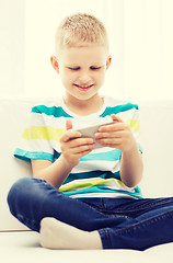 Image showing smiling little boy with smartphone