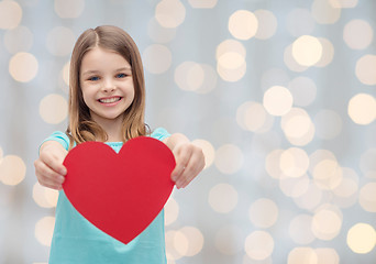 Image showing smiling little girl with red heart