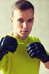 Image showing young man in boxing gloves