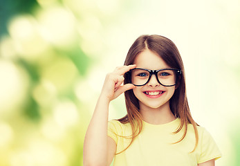 Image showing smiling cute little girl in black eyeglasses