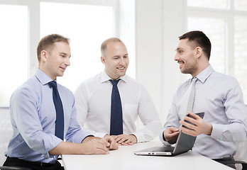 Image showing business team working with laptop in office