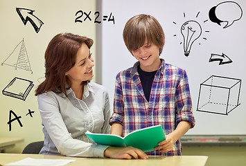 Image showing school boy with notebook and teacher in classroom