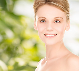 Image showing close up of smiling woman over green background
