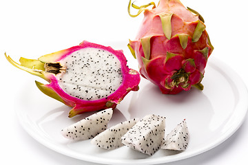 Image showing Pitaya Fruit Wedges, A Halved And A Whole Fruit