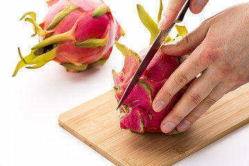 Image showing Knife In Position For a First Cut Through A Pitaya