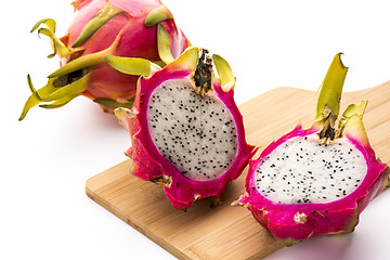 Image showing Two Pitaya Halves And A Whole Dragonfruit