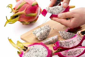 Image showing Separating Pitaya Fruit Pulp From Its Skin