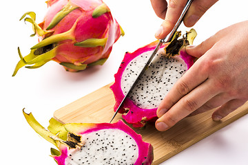 Image showing First Cut Through One Half Of A Pitaya