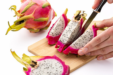Image showing Cutting Off A Second Fruit Chip From A Pitaya Half