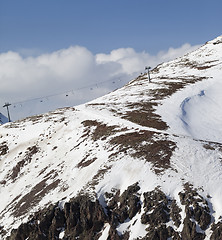 Image showing Off-piste slope with stones and chair-lift in little snow year