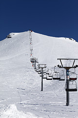 Image showing Winter mountains and ski slope at nice day